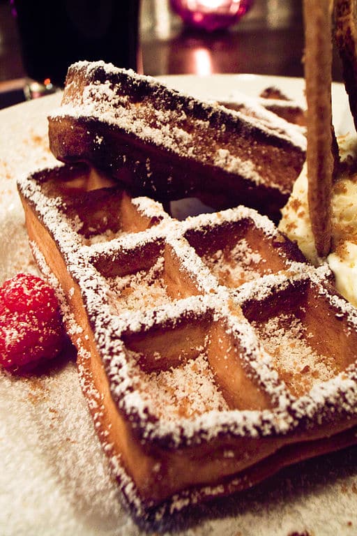 Close-up of a waffle sprinkled with powdered sugar